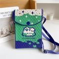 Close-up of knit crossbody bag featuring abstract mountain scenery and adjustable strap - Small Rabbit Green