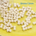 Macro view of bone-shaped white synthetic turquoise beads sized 8mmx13mm for DIY jewelry - Bone (8mmx13mm)