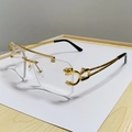 Frameless double bridge gold sunglasses with leopard head accent on 45-degree angle - Gold Frame Clear Lens