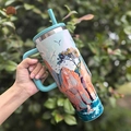 Blue handle vacuum insulated tumbler with nature landscape print and straw for outdoor use - 40oz / Red Cloud Pavilion
