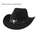 Detailed view of black cowboy hat featuring ethnic woven band and silver bull skull ornament - Tibetan Cloth Style / Black