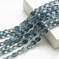 Macro shot of 10x12mm blue crystal twisted beads for DIY jewelry and beaded curtains - Plated Ink Blue