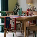 Christmas table runner with reindeer and tassel decor on a festive wooden dinner table - 35*140cm / Blue Stripe Bow + Red Tassel
