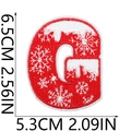 Macro view of red embroidered letter G patch with white snowflake and dimension markers - Letter G