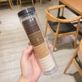 Elastic hair ties set in gradient brown earth tones packaged in a clear cylinder jar - Milk Coffee