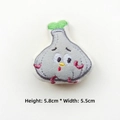 Detail view of cartoon monster embroidered patch with dimensions 5.8cm by 5.5cm - Garlic
