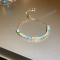 Detail of adjustable gold bolo bracelet with rectangular multicolored gemstones - Colorful Square Zirconia Bracelet
