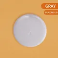 Gray silicone cat-shaped pet food can lid with ear relief design on orange background - Grey Fresh-keeping Lid