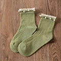 Light green ribbed mid-calf socks with white lace ruffle edges and pearl bead accents - One Size / Light Green