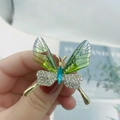 Detailed butterfly brooch with green resin wings, blue gemstone and white rhinestones - Style 59/Green Gradient Resin Rhinestone
