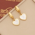 Golden heart drop earrings with white crystal inlay on a beige display stand - Heart Style / Gold