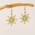 Bohemian gold sunburst earrings with oval green gemstones on natural wood branch - Gold Green