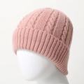 Detailed macro view of pink cable knit beanie featuring soft wool texture and ribbed cuff - One Size / Dusty Pink