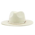 Close-up of woven straw hat texture with brown leather cord and bead decoration - Creamy White