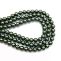 Detailed view of glossy dark green imitation shell pearls for DIY jewelry making - 10mm / Dark Green