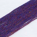 Macro shot of 2mm faceted crystal glass beads in iridescent dark purple and indigo blue - 2mm (Approx. 210 Beads per Strand) / Purple