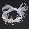 Elegant white floral girl hairband with pearls, frosted petals and organza ribbon - White Wrist Flower