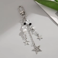 Detail of silver alloy keychain with star charms, crystal beads and a large white pearl - Silver Star Cross Style (0218)
