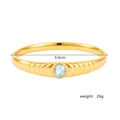 18k gold plated stainless steel bangle with light blue oval gemstone and wave texture - Gold with Blue Stone (G3561-Blue)