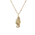 Golden seahorse pendant necklace with white zircon pavé and black gemstone eye detail - Hollow Seahorse Shape (CN001545YH)
