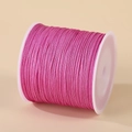 Spool of rose red 0.8mm nylon cord for handmade DIY jewelry making and knotting - Magenta