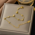 Minimalist gold titanium steel bead bracelet with polished spheres and adjustable lobster clasp - Gold Bracelet