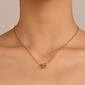 Gold interlocking double heart pendant necklace worn on neck in minimalist chic style - Gold Stainless Steel Double Heart (X674)