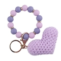 Detail of purple silicone beaded bracelet with knitted heart pendant and golden keyring - Purple