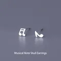 Elegant S999 pure silver music note stud earrings with a polished minimalist finish - Music Note