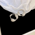 Macro shot of silver geometric twisted C-shape hoop earrings on black velvet and white paper - Silver Twisted Ear Buckle (45#)