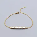 Detail of gold chain bracelet featuring five cubic zirconia gems set in hexagonal bars - Bracelet / Gold