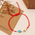 Red braided cord bracelet with blue cross bead, white pearl and gold heart charm - Red (With Gift Card)