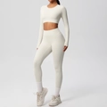 Detail of white long sleeve crop top and high waist yoga leggings with ribbed texture - S / Top And Bottom / Light Ivory