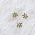Three golden alloy snowflake nail charms featuring sparkling glitter on polished metal - Style A1143-15