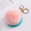 Close-up of pink faux rabbit fur ball keychain with blue folding makeup mirror - Korean Pink With Fur Ball