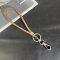 Macro detail of champagne gold rhinestone lanyard with polished silver lobster clasp hardware - 6mm Rhinestone Pendant / Champagne (K3134)