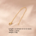 Detail view of champagne gold extension chain with lobster clasp on pink silk - 18K Gold Plated 5 Segments