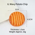 Realistic orange-yellow wavy potato chip keychain charm measuring 5x4.5x1.3cm - Wavy Potato Chip Cookie Model