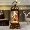 Vintage bronze Christmas lantern with Santa Claus figurine and warm LED lighting effect - Santa Claus