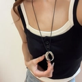Detailed close-up of a silver irregular ring pendant on a black cord necklace worn by model - 37# Necklace Silver Irregular Ring