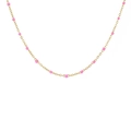 Close-up of golden necklace with delicate pink bead charms on a white background - Necklace / Rose Pink