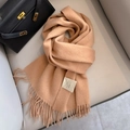 Camel 100% Australian wool scarf featuring soft tassels and fine knitted texture - Camel