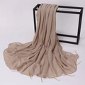 Detail of light beige chiffon shawl featuring elegant gold pins with pearl accents - 175cm / Camel