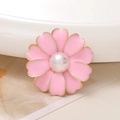 Detailed macro view of a pink enamel flower charm with golden edges and a central pearl - Pearl Center Flower / Pink