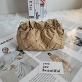 Beige woven clutch with pleated ruffle opening and pearl detail on textured plush background - Light Coffee Woven Pattern