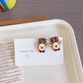 Close-up of reindeer stud earrings with red nose and brown antlers on a gift card - Reindeer - Stud