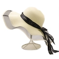 Wide brim straw sun hat with black ribbon bow and wavy mesh trim for beach vacations - Creamy White