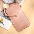 Pink crossbody phone wallet with a golden heart clasp and slim adjustable shoulder strap - Pink