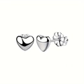 Polished silver heart stud earrings with butterfly back on white background view - Silver Heart Stud Earrings