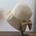 Detail of the chic straw weave texture and fabric bow accent on this sun hat - Khaki